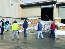 People touring transfer station